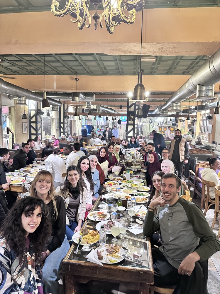 Misbah Center students sharing a traditional meal in Amman